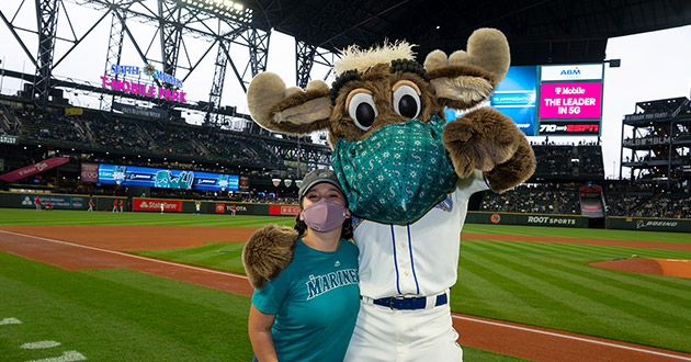 Megan Cisneros with the Mariner Moose at the final game of the season